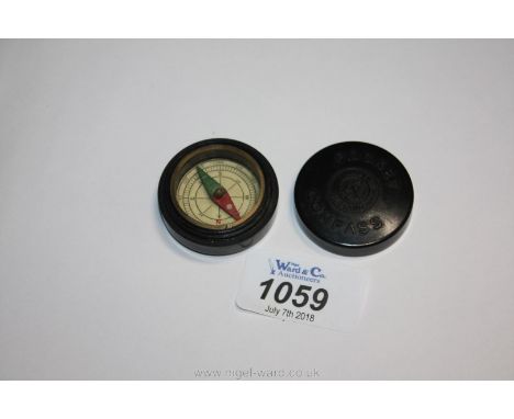 A 20th c. bakelite pocket compass stamped ESL, 1 1/4" diameter