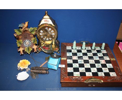 A Cuckoo Clock, Eluxa mantle clock, chess set, Capo-di-monte rose, pair of National Trust field glasses, etc