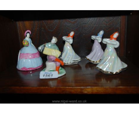 Four small Avaebo figures and a Carltonware crinoline lady Napkin Ring