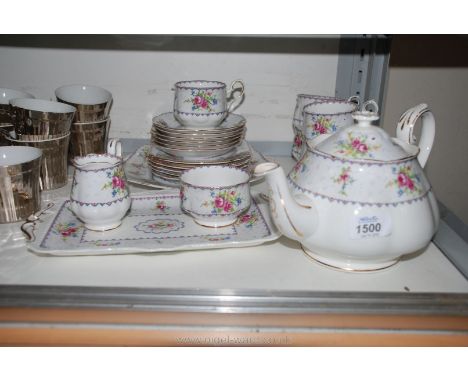 A Petit point Royal Albert bone china Tea set including teapot, sugar bowl, cream jug, two sandwich serving dishes, six bread