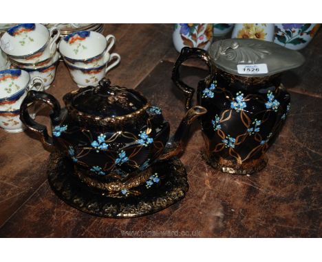 A Victorian teapot, stand and water jug with forget me not decoration