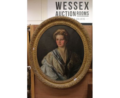 A large gilt framed oval early 20th century oil on canvas portrait of a young woman believed to be Ruth Evelyn Howard Windsor