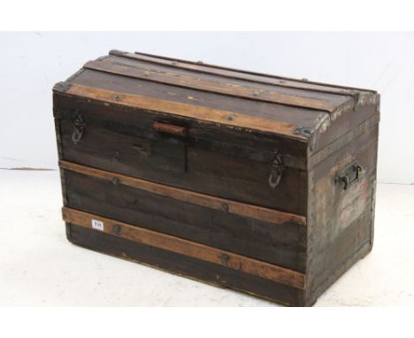 19th century Wooden Bound and Canvas Covered Domed Top Travelling Trunk with travel labels, 77cms wide x 50cms high 