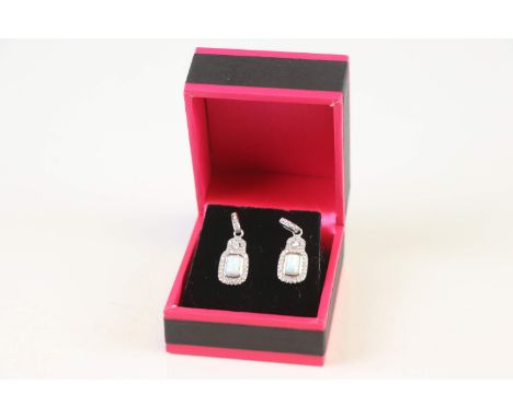 A pair of silver cz and opal drop earrings 