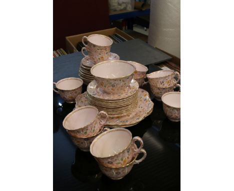 Early 20th century Royal Worcester Tea Service, pink ground and decorated with butterflies , flowers and highlighted in gilt,