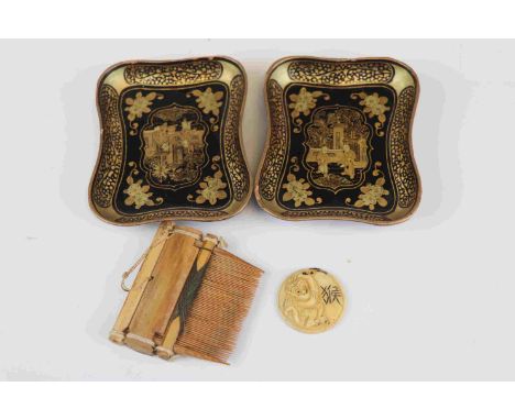 Two vintage oriental lacquer ware pin trays together with a wooden comb. 