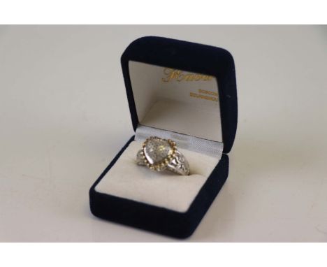 A heart shaped diamond set ring 