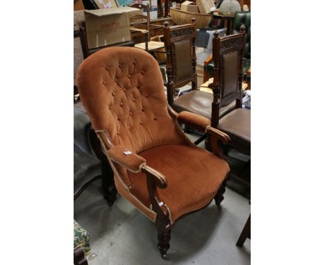 William IV Armchair with Orange Button Back Upholstery, carved scroll arms, turned front legs with castors 