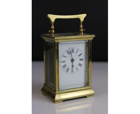 Brass Cased Carriage Clock, the white enamel face with Roman numerals, 15cms high 