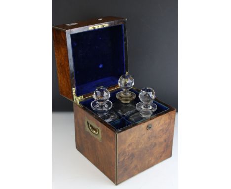 An early 20th century burr walnut Army And Navy Campaign four division decanter box with brass handles and cartouche dated 19