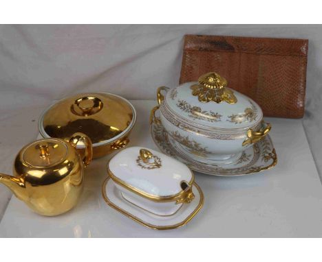 A vintage snakeskin with purse and a quantity of ceramic tableware. 