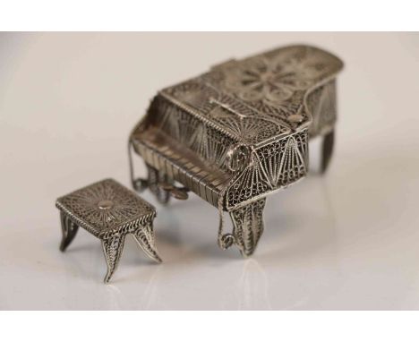 A vintage filigree wire work piano and stool trinket box. 