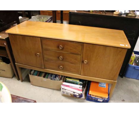 1960's Gordon Russell Walnut Sideboard with three drawers and two cupboards, label to reverse, 141cm long x 85cms high 