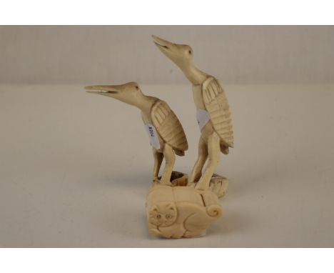 Two vintage carved bone birds together with a similar trinket box in the form of a cat. 