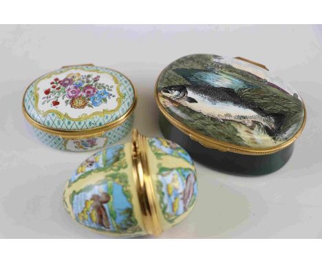 A group of three enamel decorated trinket boxes to include a Halcyon Days example. 