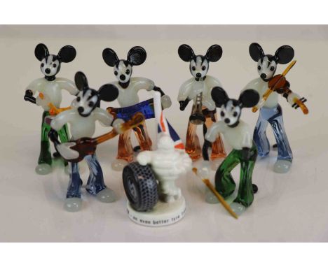 A collection of vintage Glass mice in the form of musicians together with a porcelain Michelin tyres ornament.