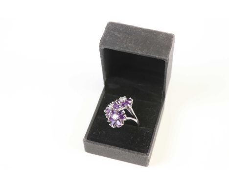 A silver cz and amethyst ring 
