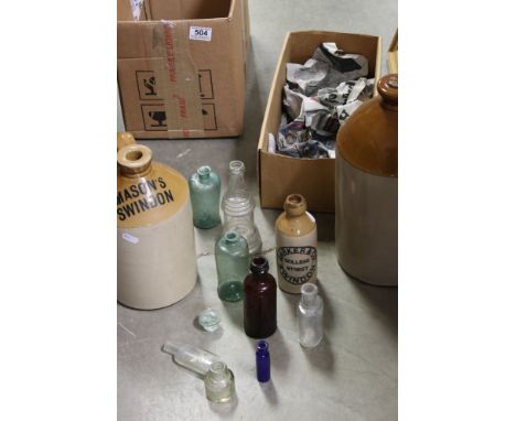 A group of three salt glaze pottery bottles to include Swindon examples together with a small collection of vintage bottles. 