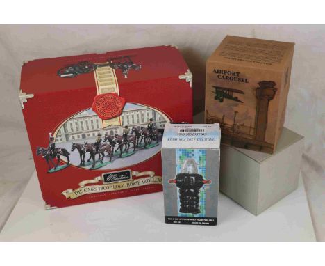 A contemporary boxed tinplate Airport Carousel, a boxed Robot figure and a Fairground Carousel and a boxed Britain Kings Hors