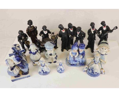 A group of resin figures in the form of musicians together with a group of Dutch ceramic figures. 