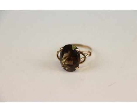 A hallmarked 9ct gold and smokey quartz dress ring. 