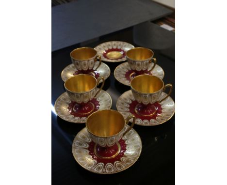 Royal Worcester Cabinet Five Coffee Cups and Six Saucers, with gold painted decoration on a white and maroon ground, speciall