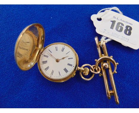 An enamelled 14ct pocket watch and a 9ct Brooch, Dog clip, R150