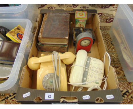 A box of odds, two phones, clock etc.