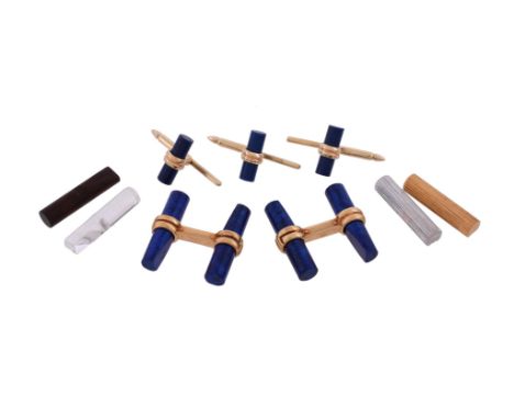 A cufflink set by Boucheron, the bar link cufflinks with interchangeable baton terminals, including striated gold and white g