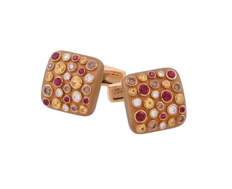 A pair of diamond, brown diamond, ruby and yellow sapphire cufflinks by William & Son, the matt gold squared panels set with 