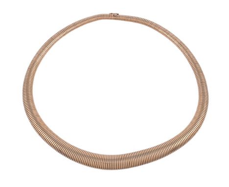 A 1960s graduated tubogas necklace, the sprung collar measuring 0.6cm to 1.2cm wide, to a concealed clasp, 45.5cm long, 61.7g
