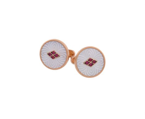 Y A pair of ruby and mother of pearl cufflinks by William & Son, the circular engraved mother of pearl panels centred with a 