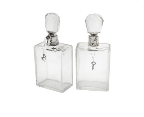 A silver mounted lockable glass decanter by Hukin & Heath Ltd., Birmingham 1922, with a keylock flip clasp, 25.5cm (10in) hig