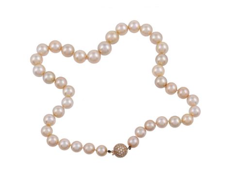 A graduated South Sea cultured pearl necklace by family repute retailed by Graff, the thirty nine graduated champagne coloure