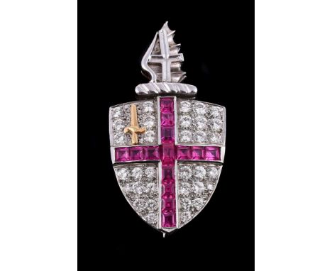A diamond and synthetic ruby City of London brooch, the brilliant cut diamond set shield shaped brooch with a channel set syn