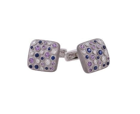 A pair of diamond and sapphire cufflinks by William & Son, the matt white gold panels set with circular cut sapphires, pink s