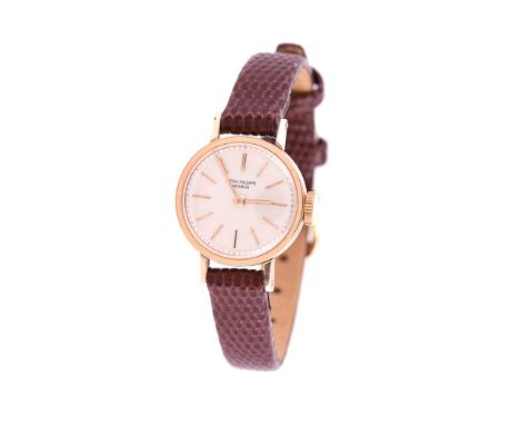Y Patek Philippe, a lady's gold coloured wrist watch, no. 624397, circa 1950, manual wind movement, silvered dial, applied ba