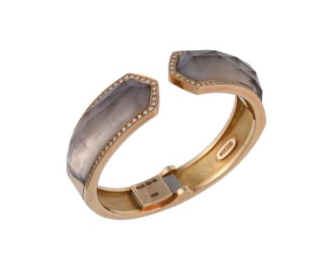Y An 18 carat gold Crystal Haze hinged bangle by Stephen Webster, the faceted crystal above a mother of pearl panel, within a