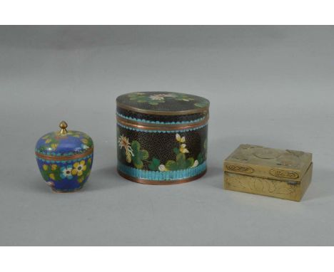 A far eastern metal and enamel cloisonne circular jar and cover,  8.5cm high, with a smaller jar and cover, and a Chinese bra