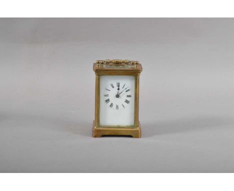 A first half of the 20th century brass carriage clock, the enamel dial with Roman Numerals, unnamed, the case, with four beve