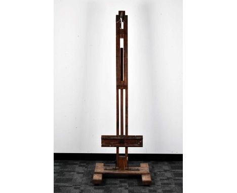 A wooden artists easel, paint stained, adjustable bracket, on an H-shaped base, 184cm H x 62cm W