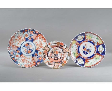 Two 19th century scalloped rimmed Chinese plates,  of differing sizes and designs, both with blue hand painted decoration to 