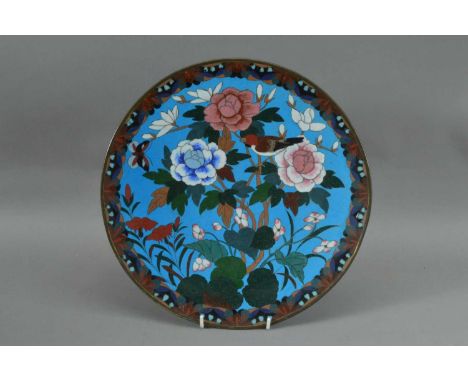PLEASE NOTE CHANGE OF DESCRIPTION!A Far Eastern metal and enamel cloisonne dish, with a floral design on a blue ground, some 