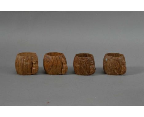 Workshop of Robert 'Mouseman' Thompson, four carved oak napkin rings, each with the signature mouse, all approx. 4.5cm H x 5.