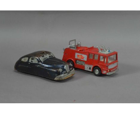 A mid 20th century tin plate toy police car,  in play worn condition 15.5cm in length, together with a later Dinky toy fire e