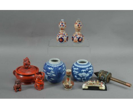 An assorted collection of Asian works of art, comprising two small blue and white ginger jars, the tallest 11cm high, redware