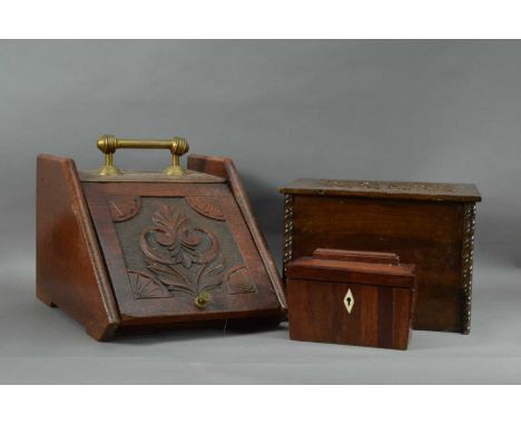 A wood and brass coal scuttle, 27cm H x 32cm W, together with an oak box, the top wth carvings, and a 20th century tea caddy,