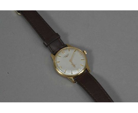 A c.1960's Longines 9ct. gold cased manual wind gentleman's wristwatch, the dial with Arabic numerals and batons, and 3cm in 