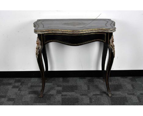 A 19th century French Boulle work style card table, ebonised top inlaid with pierced metal to the shaped base fold over top, 