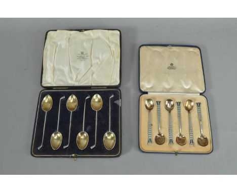 A cased set of six George V silver tea spoons, the handles in the form of golf clubs, silver gilt bowls, each marked Chester 